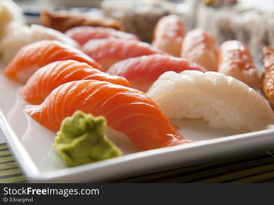 Several kinds of raw fish served as sushi at japanese restaurant.