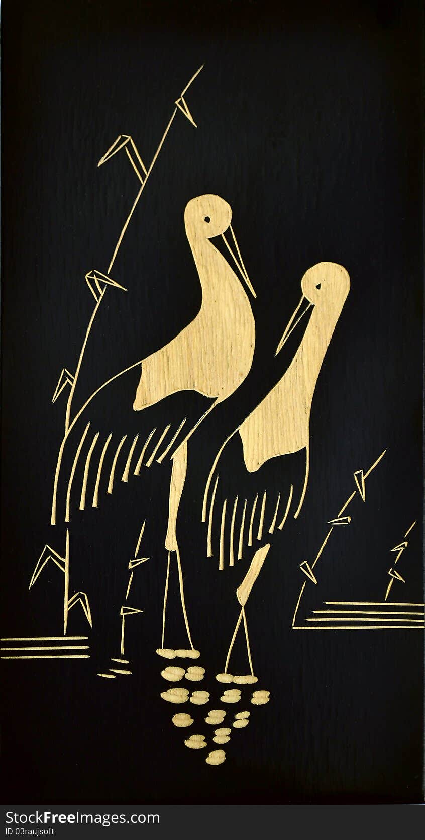 A wooden picture of a stork couple. A wooden picture of a stork couple