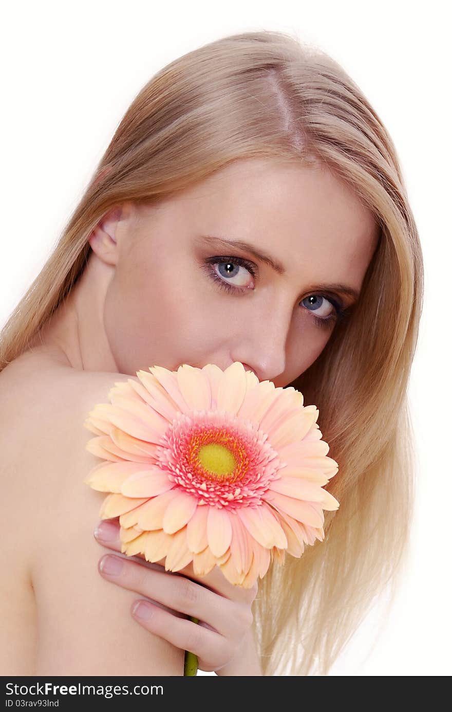 Attractive young woman with a flower. Spring, summer girl, concept of healthy lifestyle metaphor.