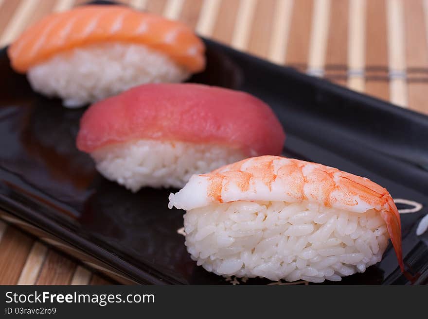 Fish sushi set on sushi plate. Selective focus.