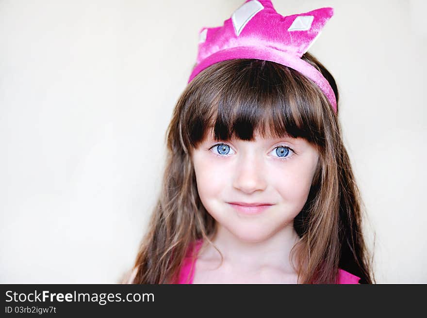 Portrait of beautiful little girl in pink tiara, isolated. Portrait of beautiful little girl in pink tiara, isolated