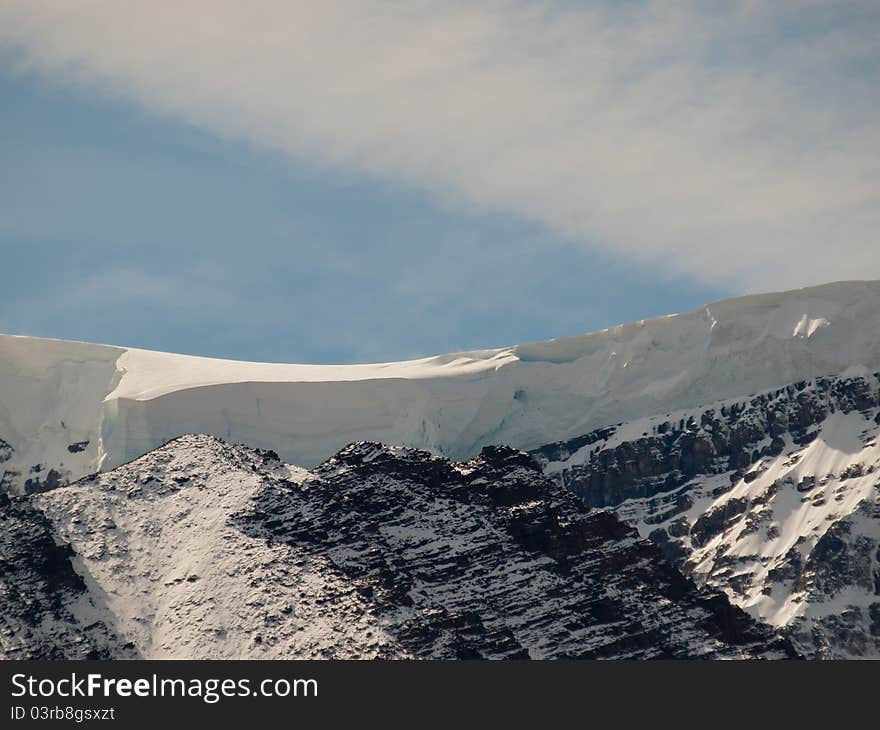 Giant snow drift on the top of a mountain. Giant snow drift on the top of a mountain