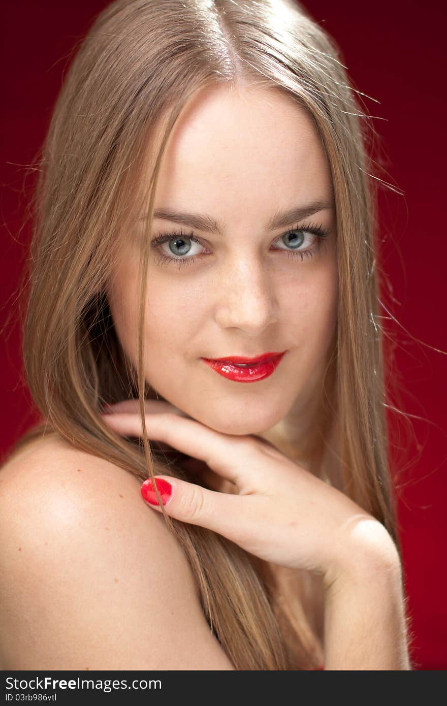 Happy woman with red lips and manicure