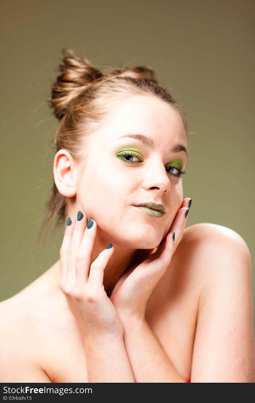 Ecology concept beautiful woman with luxury makeup green manicure, lips and cockade. Ecology concept beautiful woman with luxury makeup green manicure, lips and cockade