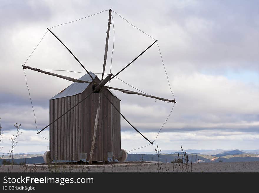 Rare and unique Portuguese traditional windmill with the particularity of weathervane, turning on itself to capture the wind. Rare and unique Portuguese traditional windmill with the particularity of weathervane, turning on itself to capture the wind