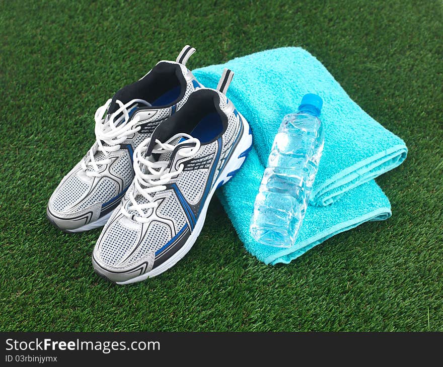 Sports runners situated on artificial turf