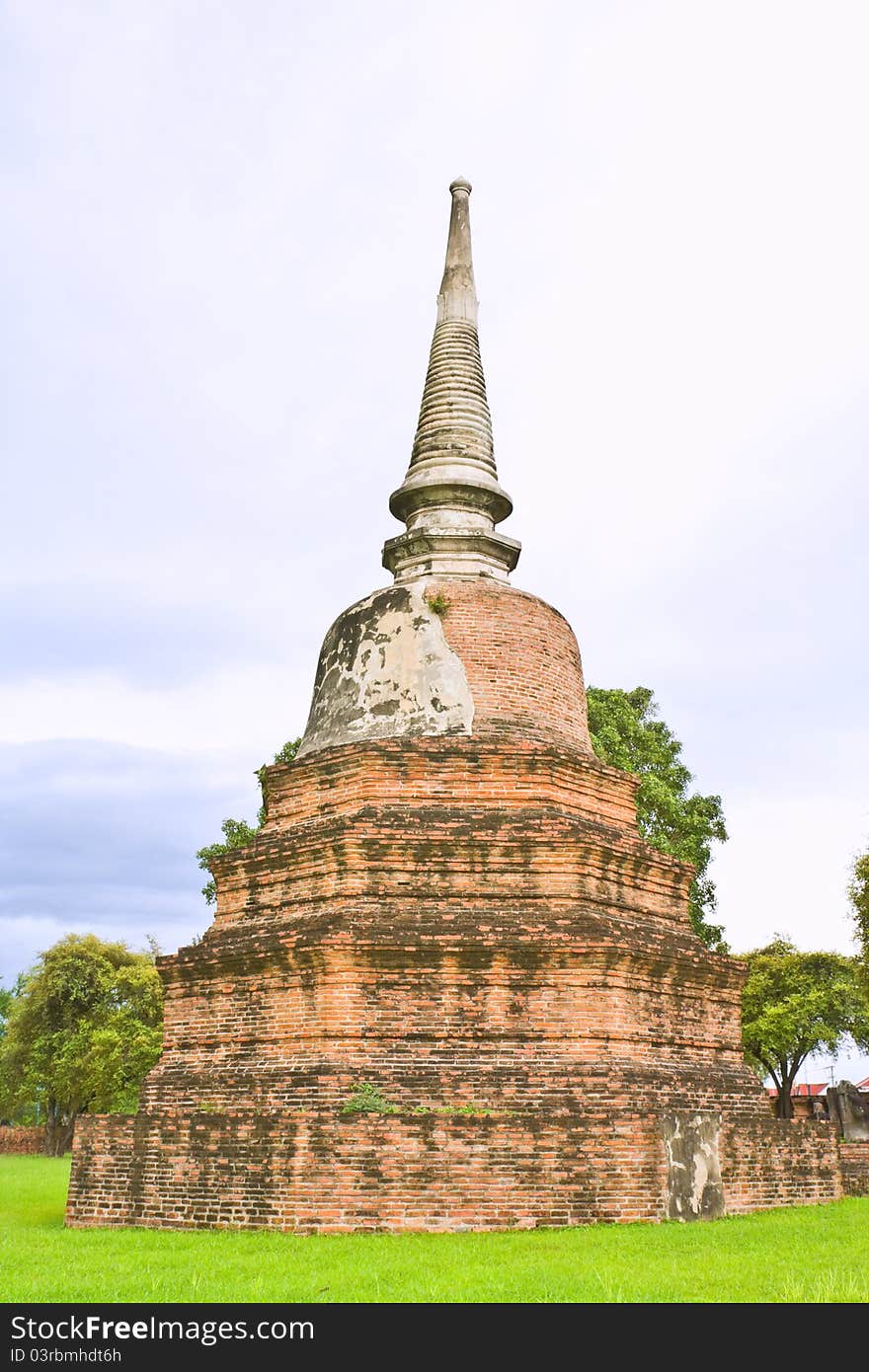 Grand old pagoda surrounded by green grass