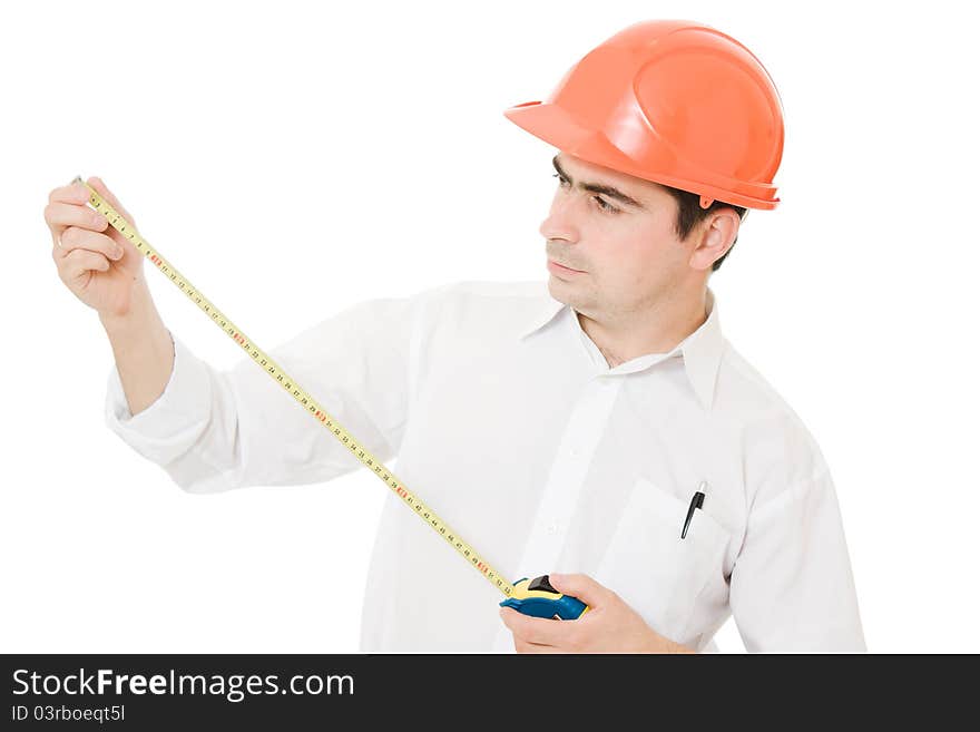 Businessman in a helmet with a meter in his hands on a white background. Businessman in a helmet with a meter in his hands on a white background