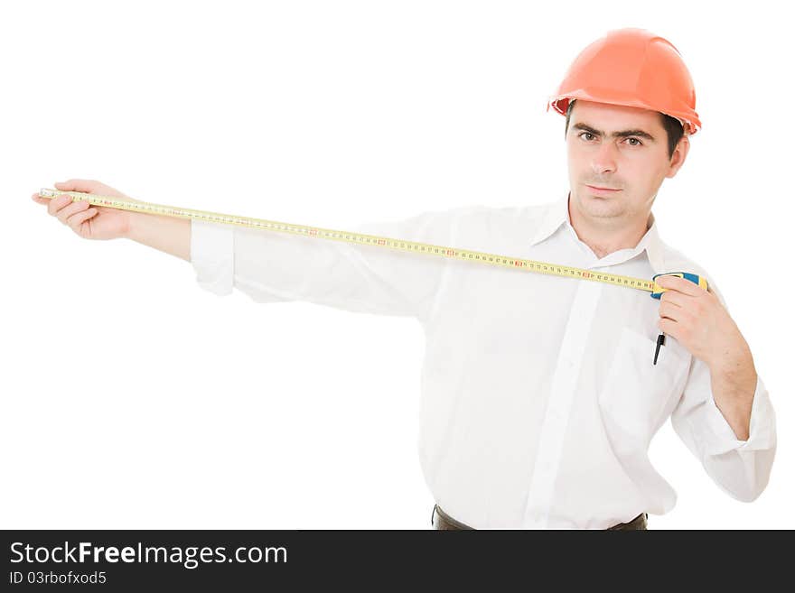 Businessman in a helmet with a meter in his hands on a white background. Businessman in a helmet with a meter in his hands on a white background