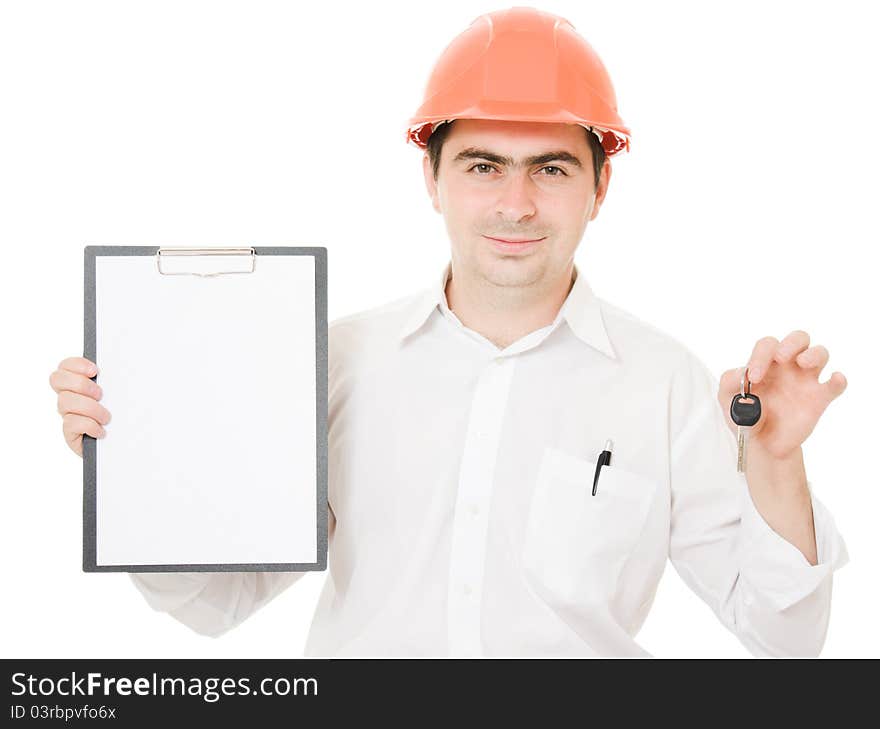 Businessman with a key in the helmet shows the blank page on a white background. Businessman with a key in the helmet shows the blank page on a white background.