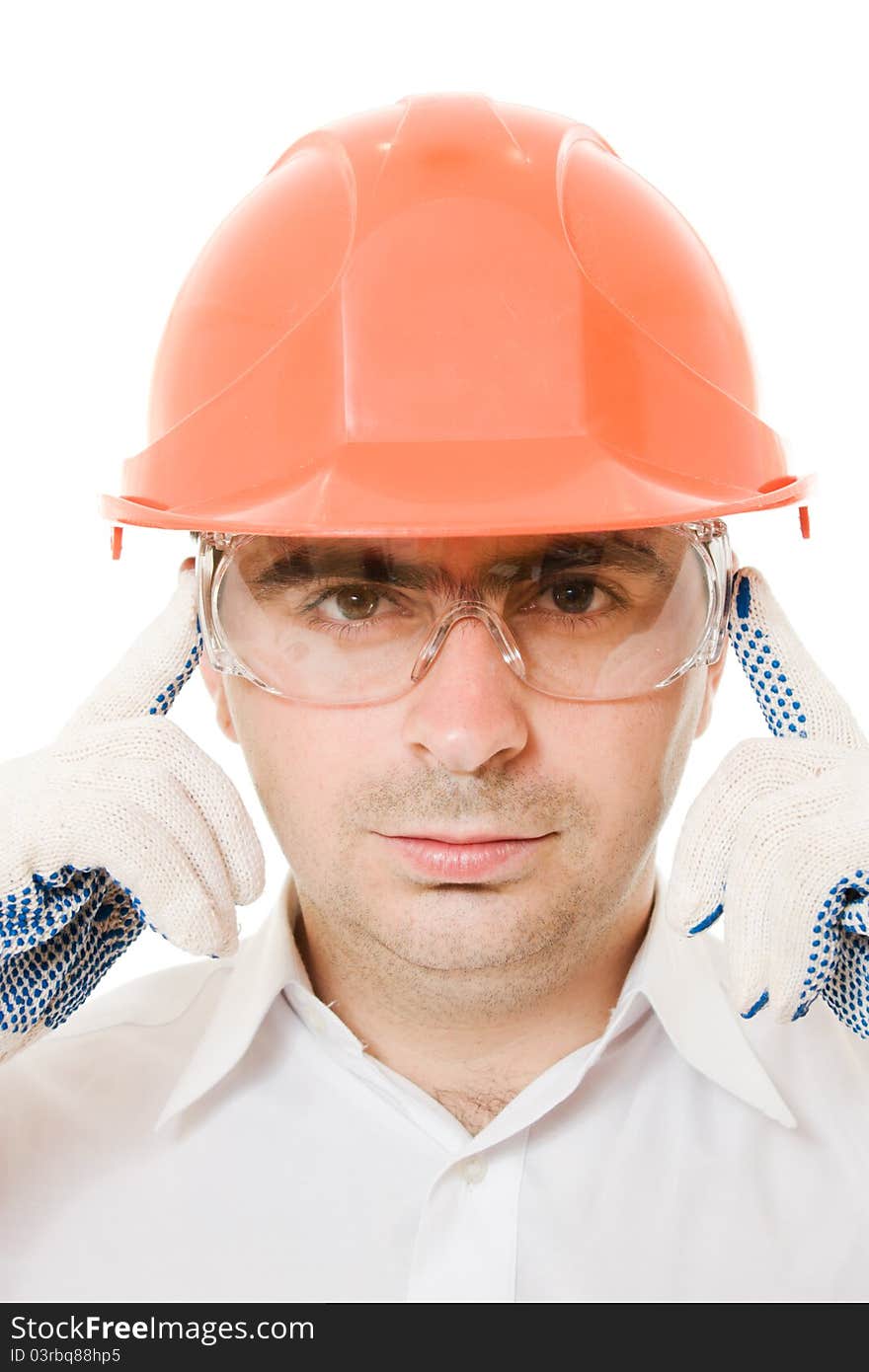 Businessman in a helmet on a white background.