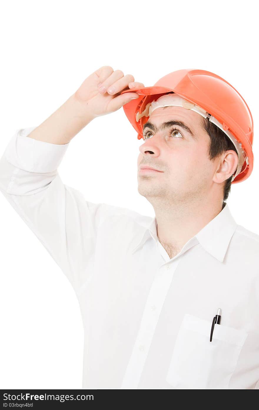 Businessman in a helmet looking up on a white background. Businessman in a helmet looking up on a white background.