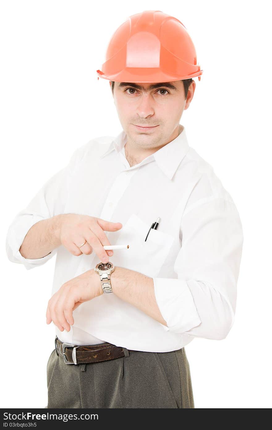 Businessman in a helmet with a cigarette on a white background. Businessman in a helmet with a cigarette on a white background.