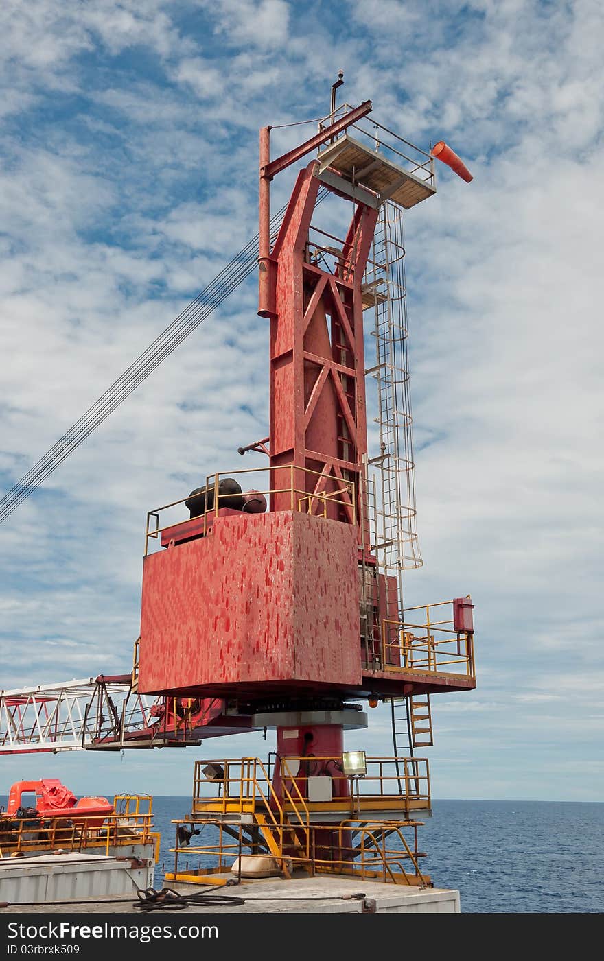 Body and boom of a crane resting on-board the drilling unit offshore Vietnam. Body and boom of a crane resting on-board the drilling unit offshore Vietnam.