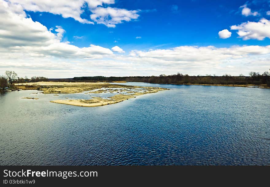 Island With Trees On Blue Cold Lake