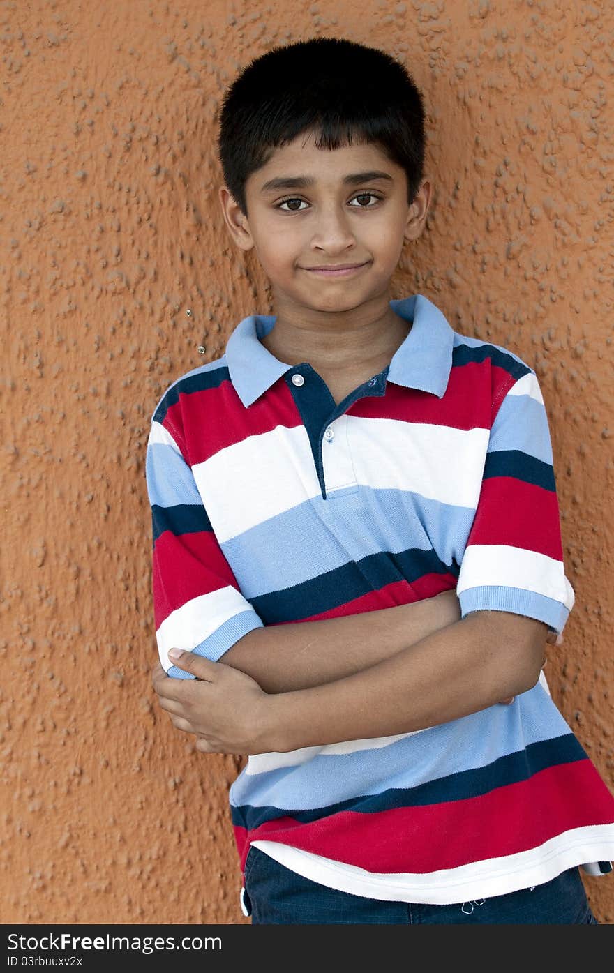 An handsome Indian kid smiling out door