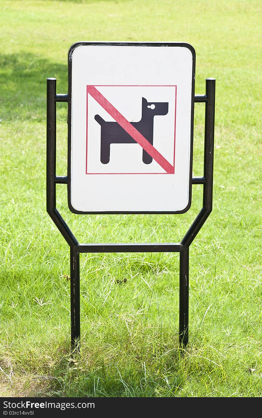 No dogs pets allowed warning sign