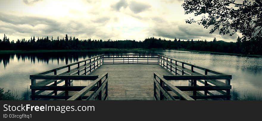 View on a small lake from wooden lookout