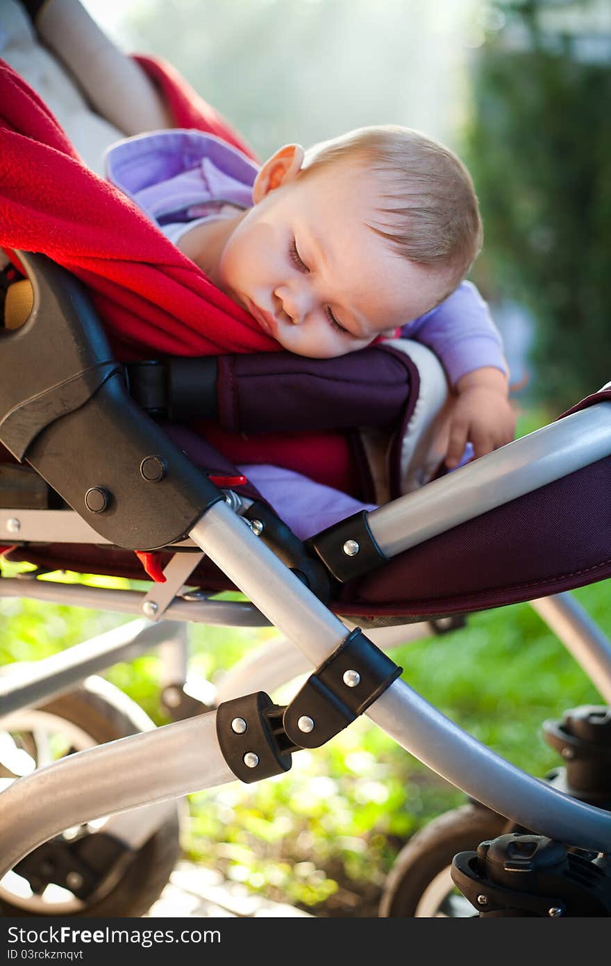 Photo of baby sleeping peacefully outdoors