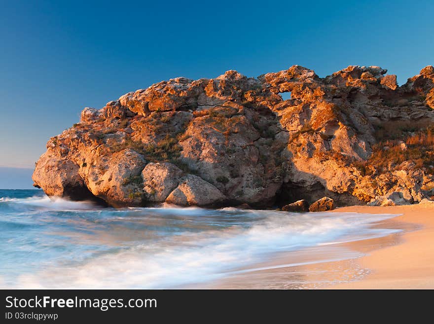 Beautiful rock on the Sea of Azov shore at the sunset. Beautiful rock on the Sea of Azov shore at the sunset