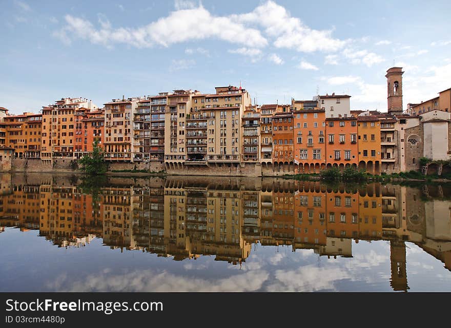 Buildings reflected on the river Arno in Florence. Buildings reflected on the river Arno in Florence