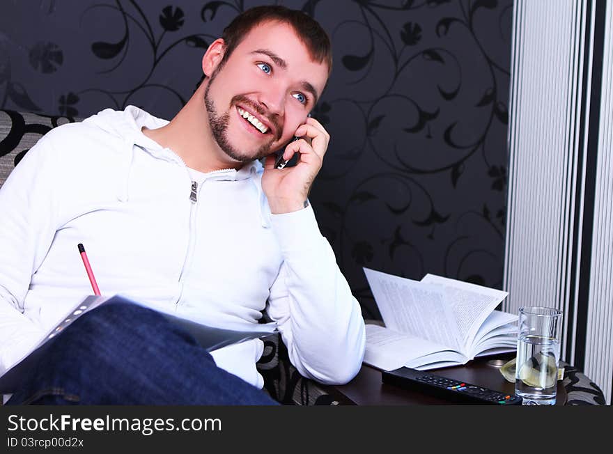 Young guy calling by phone