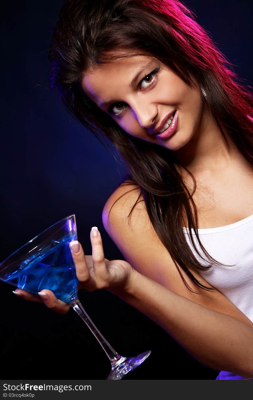 Young and beautiful woman in the nightclub