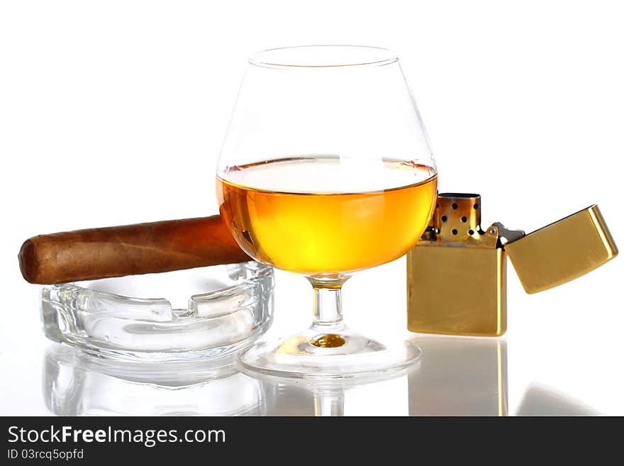 Glass of Whiskey and Cigar against white background