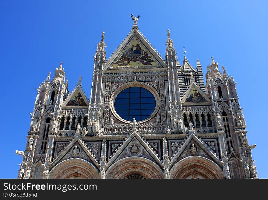 Facade of the Cathedral of Siena, a medieval church in Siena, Italy. Facade of the Cathedral of Siena, a medieval church in Siena, Italy