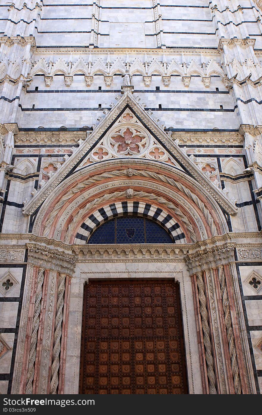 The door of the Cathedral of Siena, medieval church in Siena, Italy