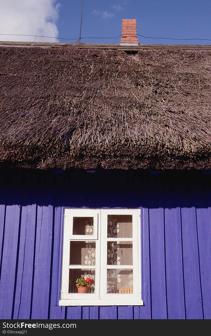 Retro wooden house fragment with window