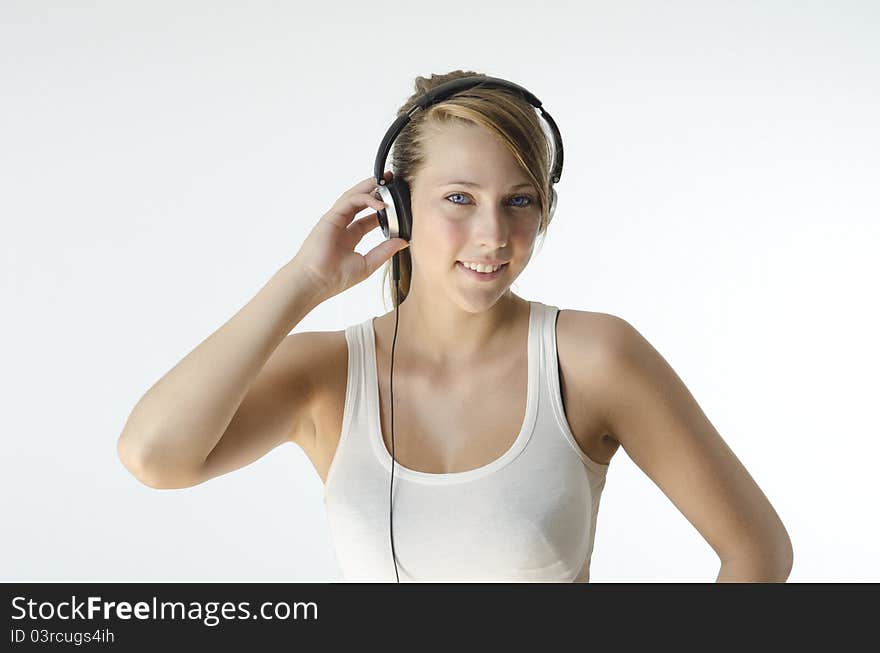 A girl listening to music on her headphones