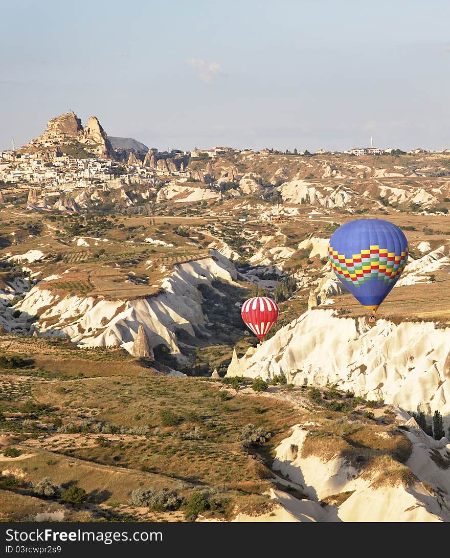 Low flying balloons ravine Uchisar Turkey