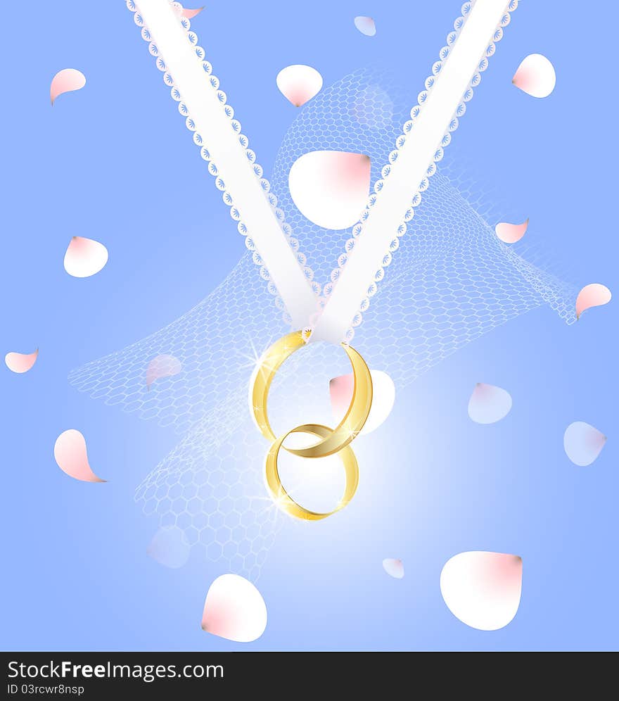 Two gold wedding rings on a white ribbon, behind the pink petals