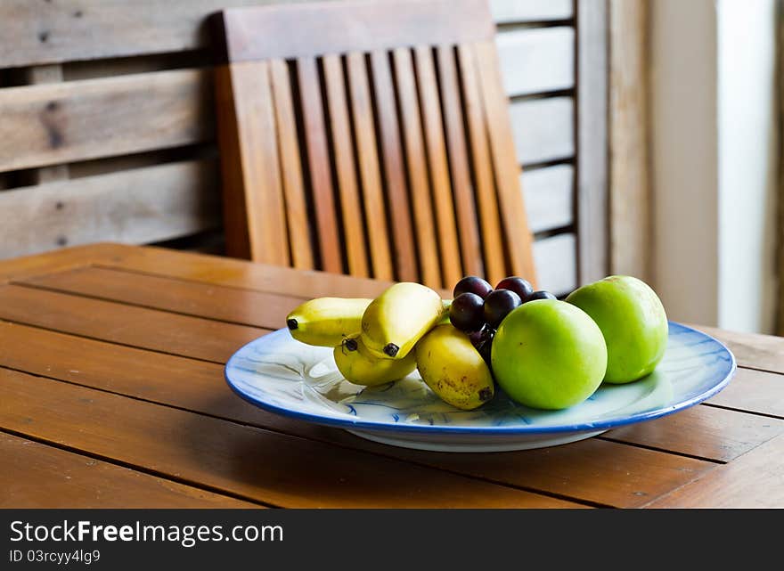 Tropical fruits on wood table