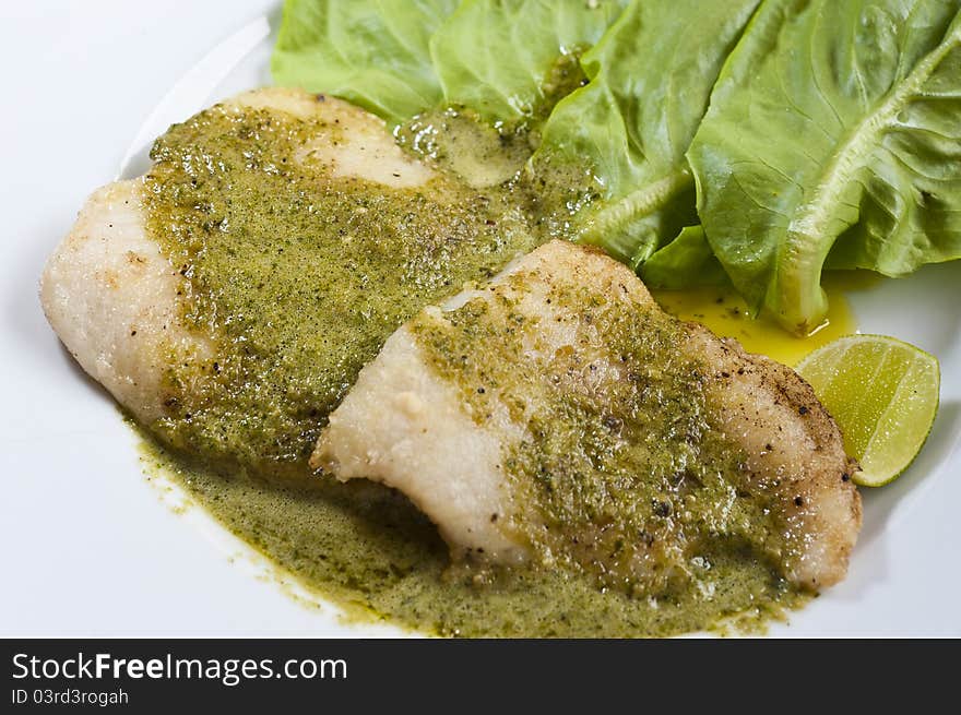 Fish Steak And Vegetable On White Plate