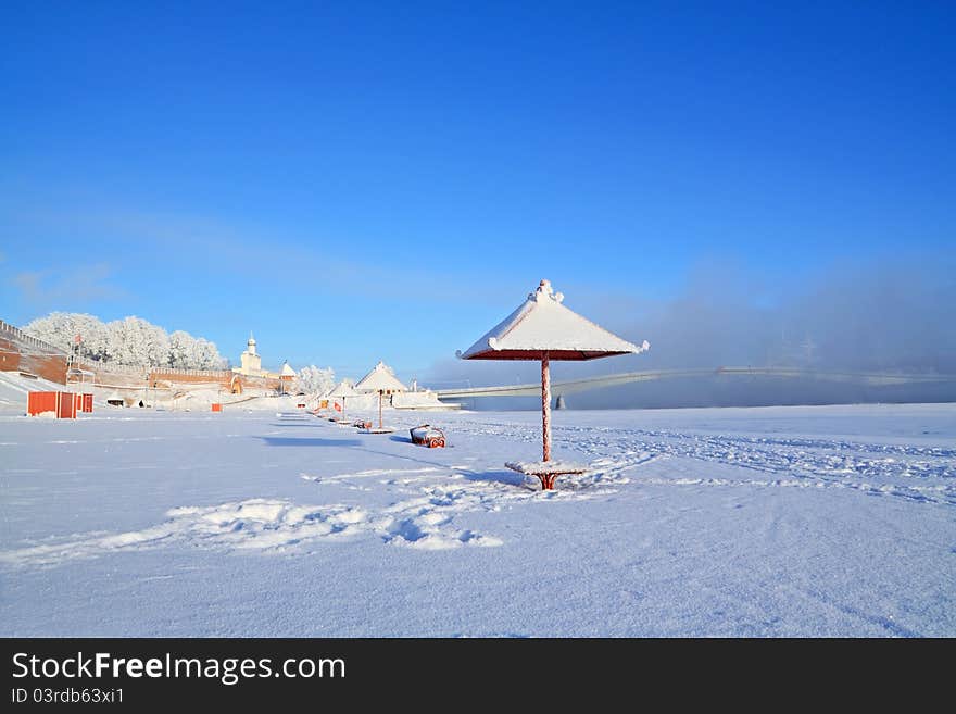 Town beach in  in winter snow