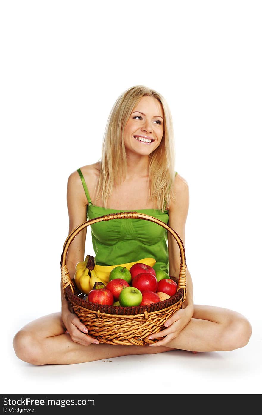 Woman holds a basket of fruit