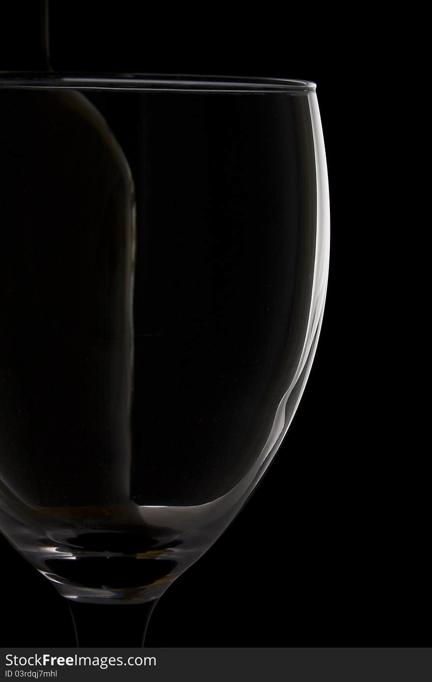 Impression of a wine glass and wine bottle against a black background. Impression of a wine glass and wine bottle against a black background