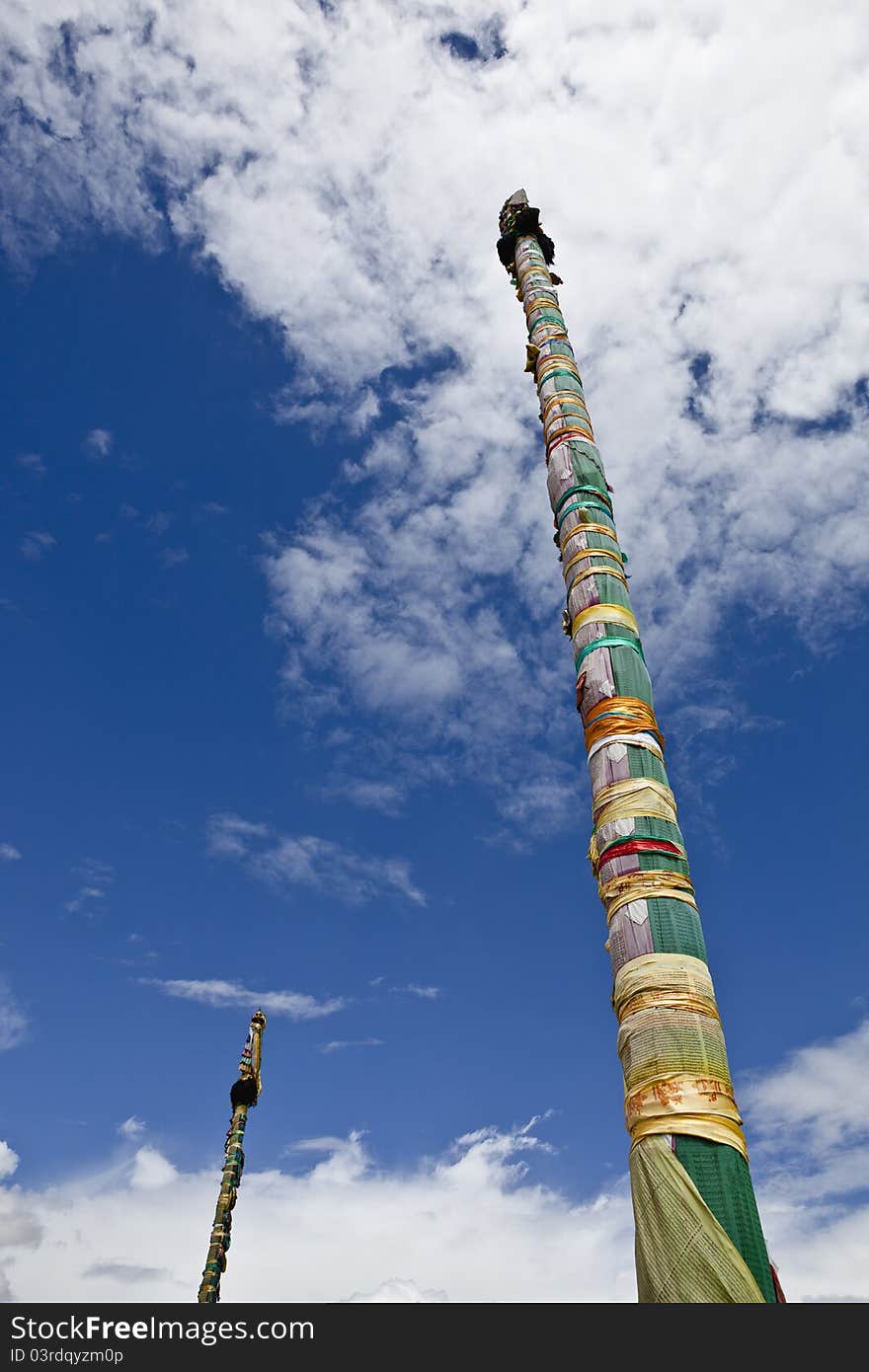 Two prayer flag poles outside jokhang temple in lhasa, tibet. Two prayer flag poles outside jokhang temple in lhasa, tibet.