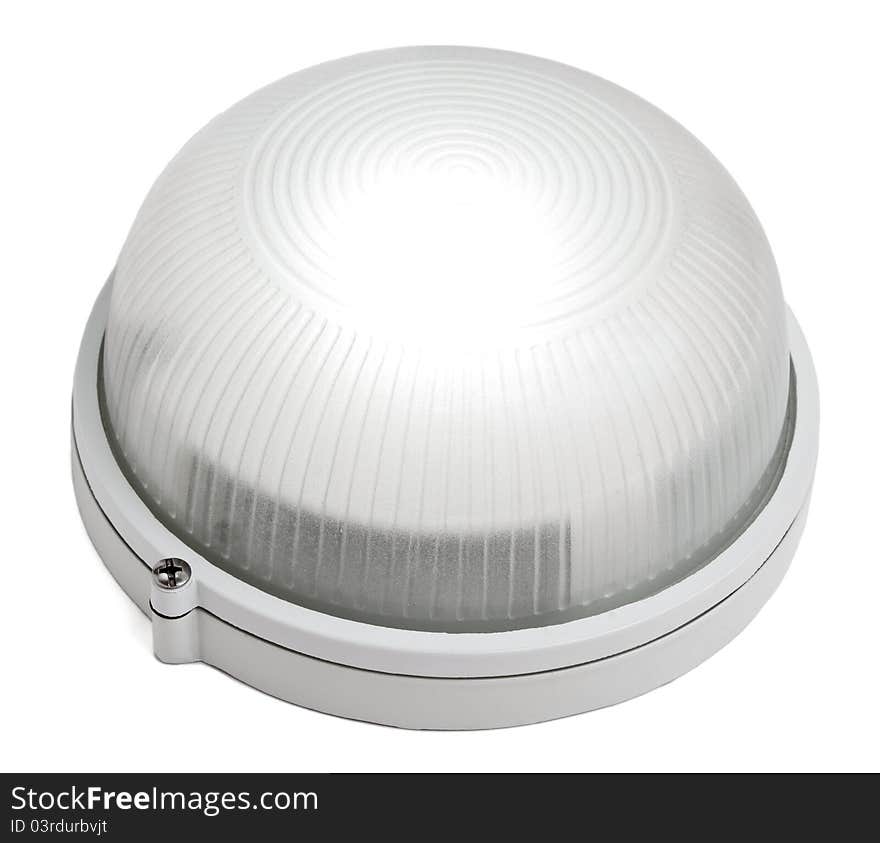 The round white lamp is shone. Isolated on a white background