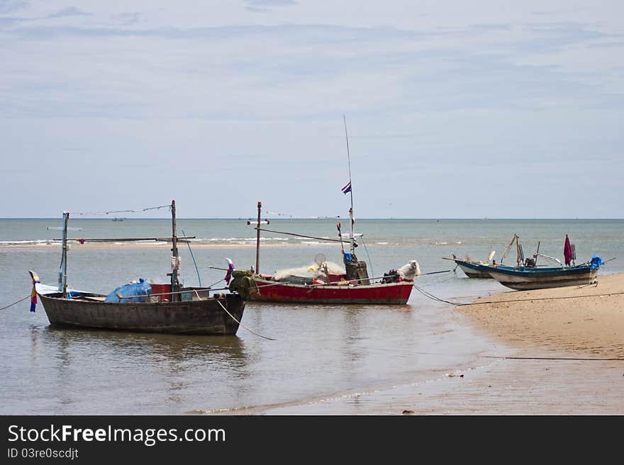 The Group of fishing boats parking on the sea of Thailand. The Group of fishing boats parking on the sea of Thailand.