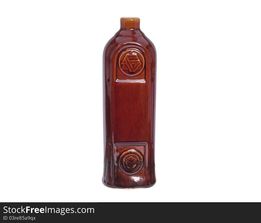 Decorative ceramic bottle with ancient symbols isolated on white background. Decorative ceramic bottle with ancient symbols isolated on white background