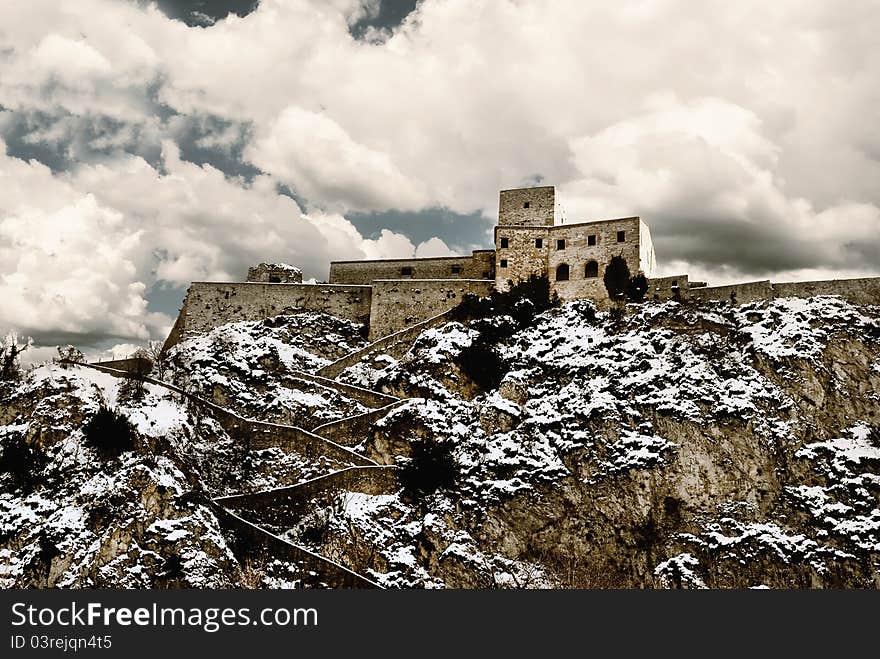 Old castle on the rocks with snow. Old castle on the rocks with snow