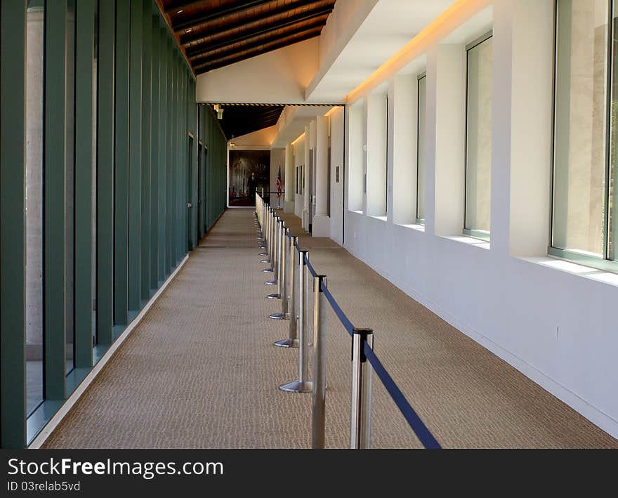 Long, sunlit divided pedestrian walkway. Long, sunlit divided pedestrian walkway