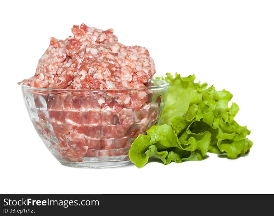 Glass bowl with minced meat and herbs on white background