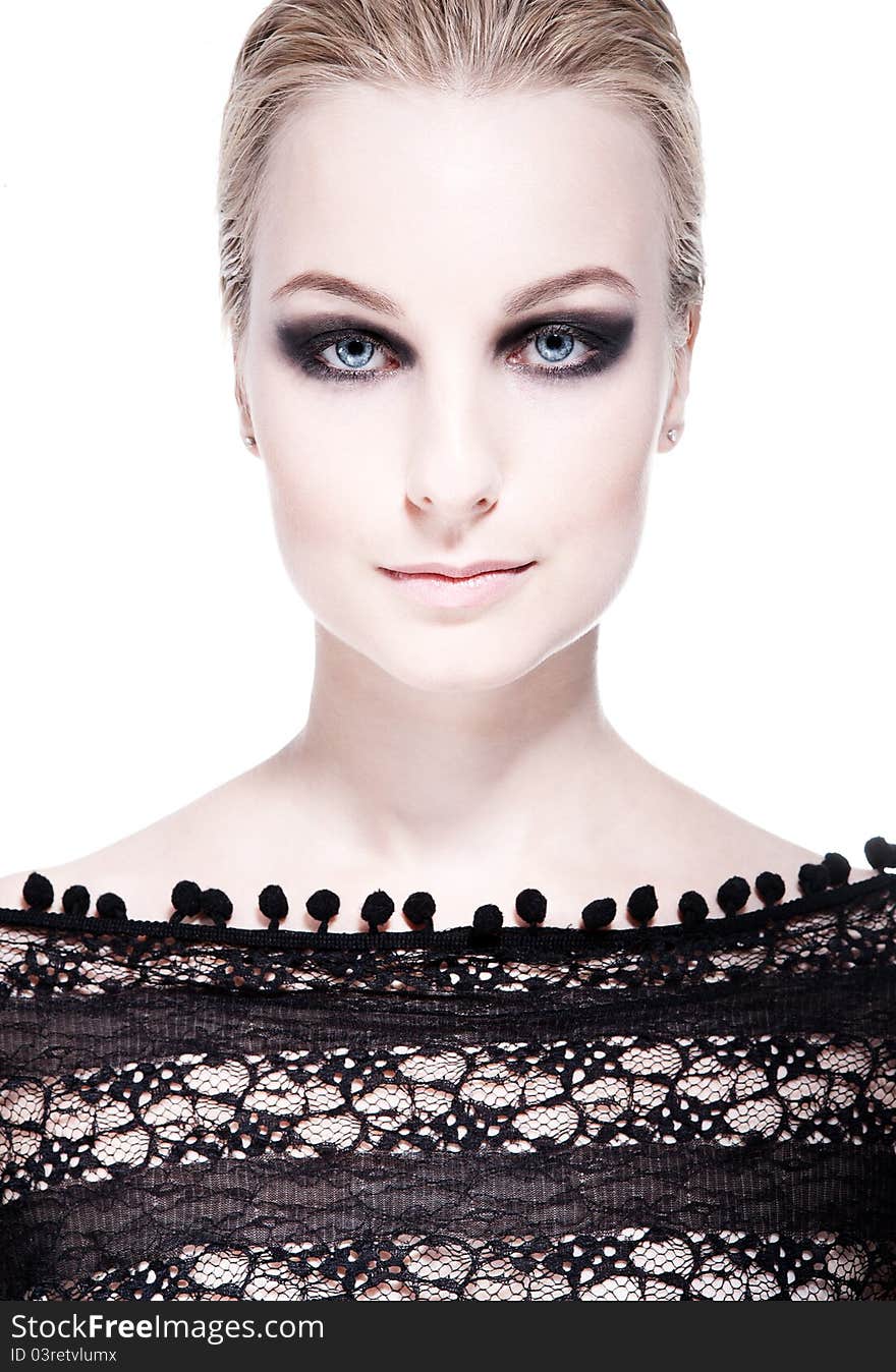 Closeup portrait of a serious lady with smoky eye makeup. Closeup portrait of a serious lady with smoky eye makeup