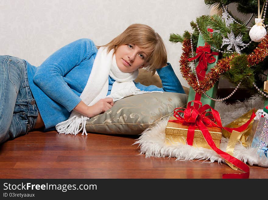 Young woman near a fir-tree