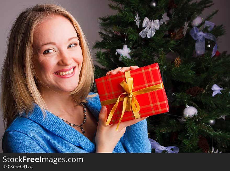 Beautiful  woman  with a Christmas gift