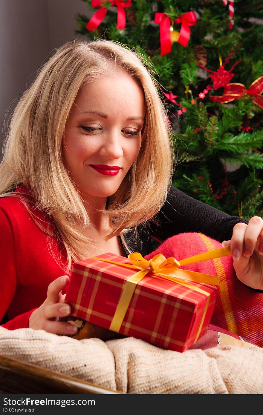 Beautiful  woman  with a Christmas gift